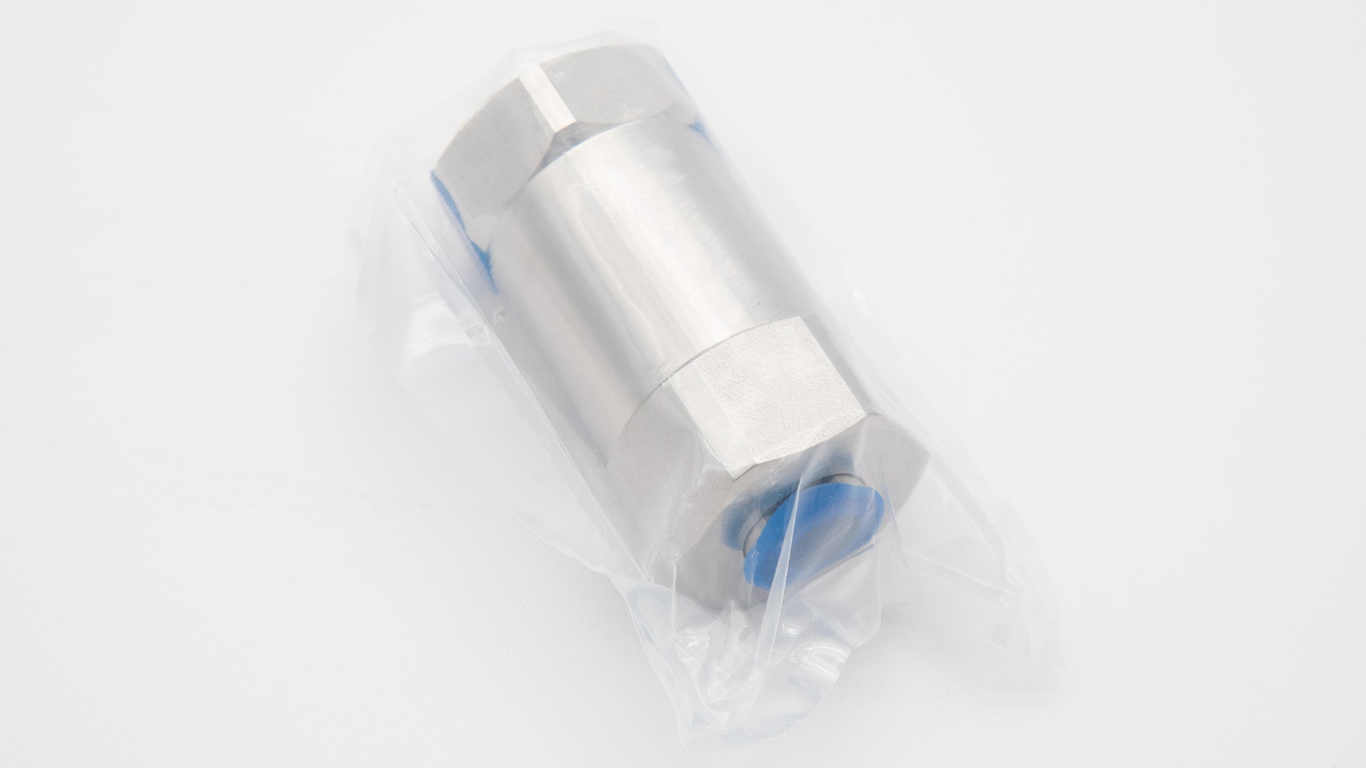 A silver cylinder in a plastic bag
