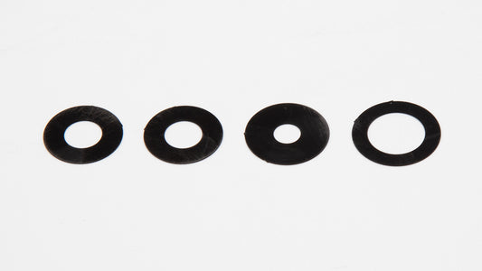 A set of four circular shaped black plastic object displayed on a white surface, emphasizing their round form and contrasting color.