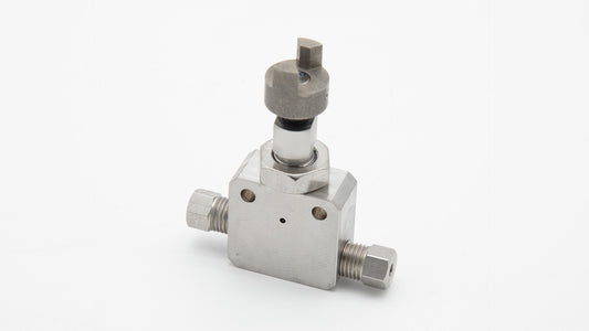 A small metallic valve displayed on a white surface, emphasizing its functional design and shiny appearance.