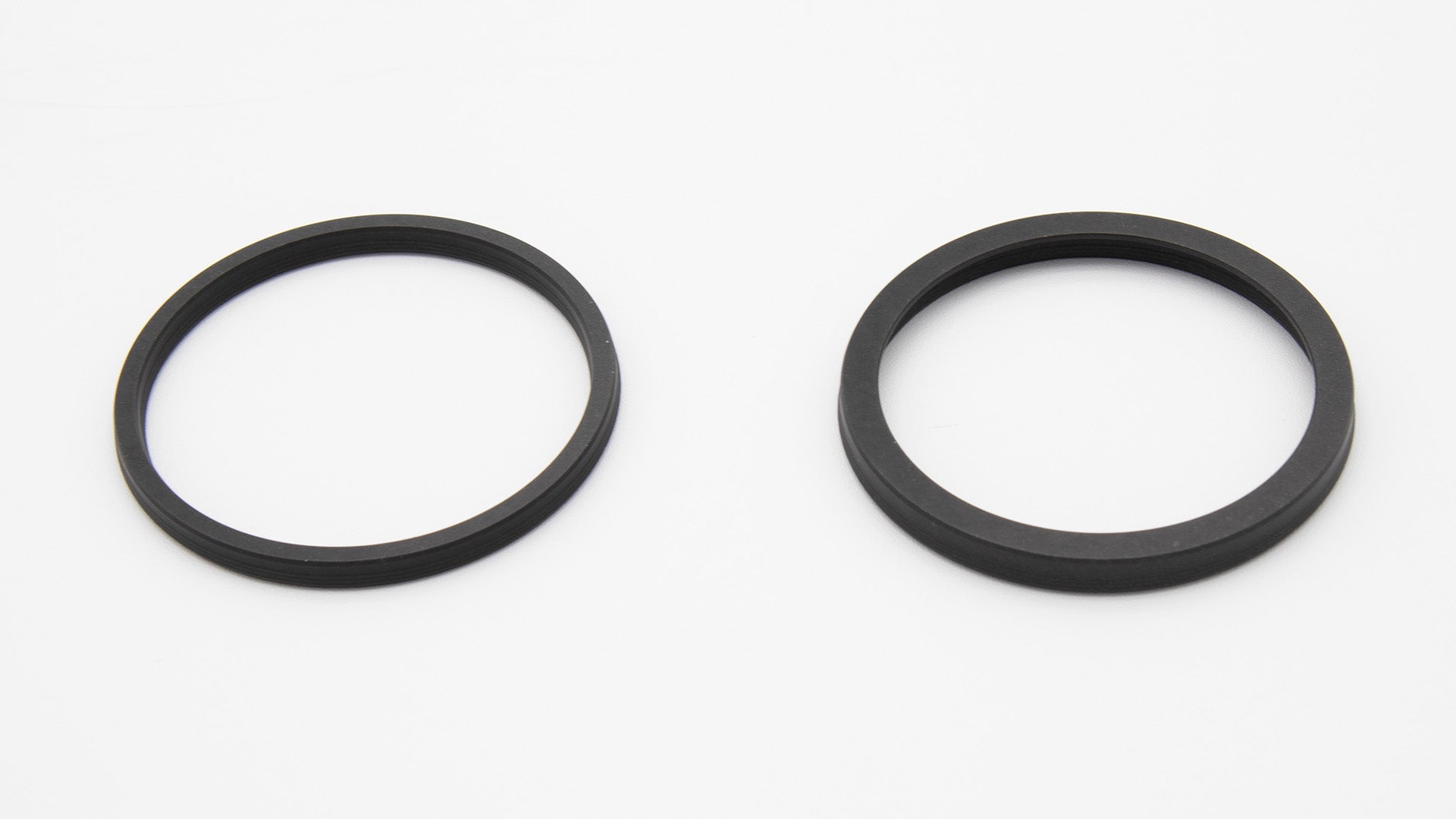 Two black circular seals.