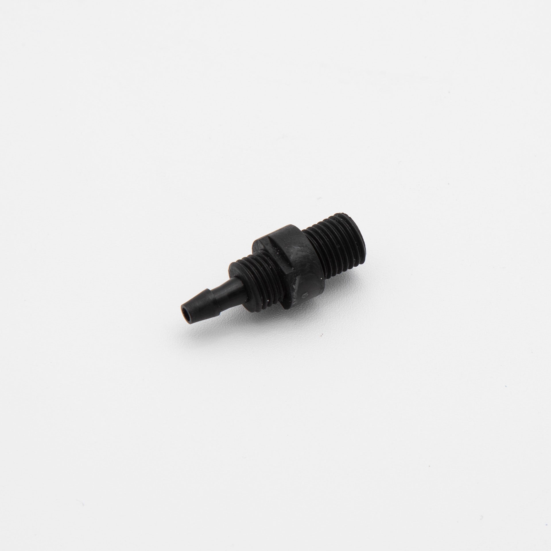 A black plastic threaded fitting positioned against a clean white background, showcasing its design and texture.