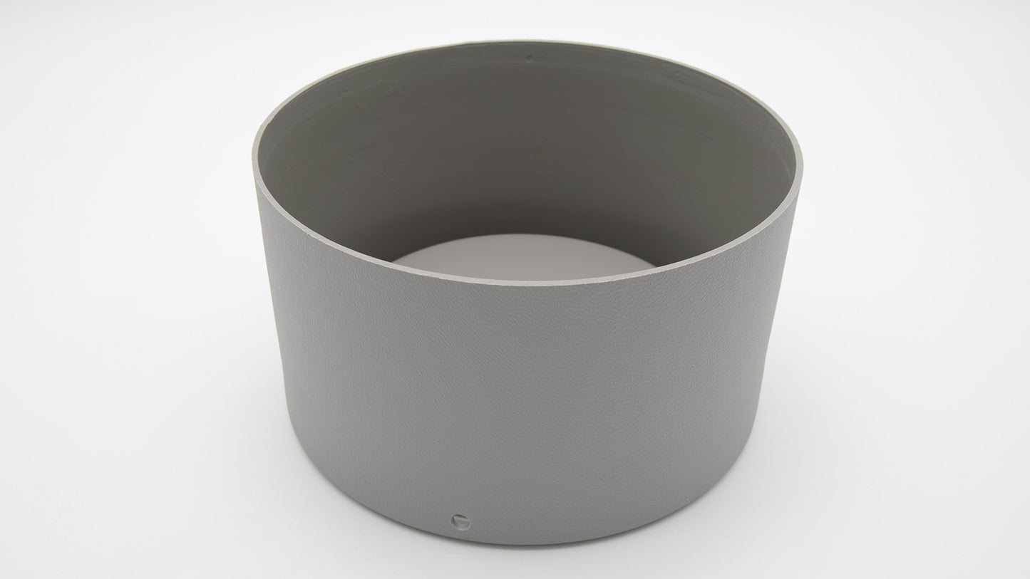 A grey cylinder with holes