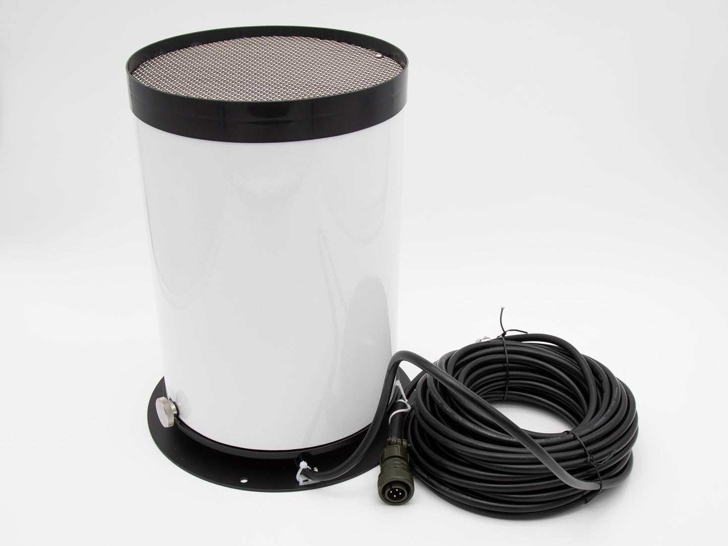 White cylindrical object with black base and spool of cord with connector.