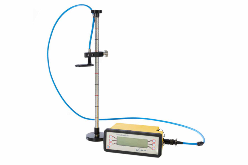 A digital meter featuring a connected hose, used for monitoring fluid levels or pressure readings.