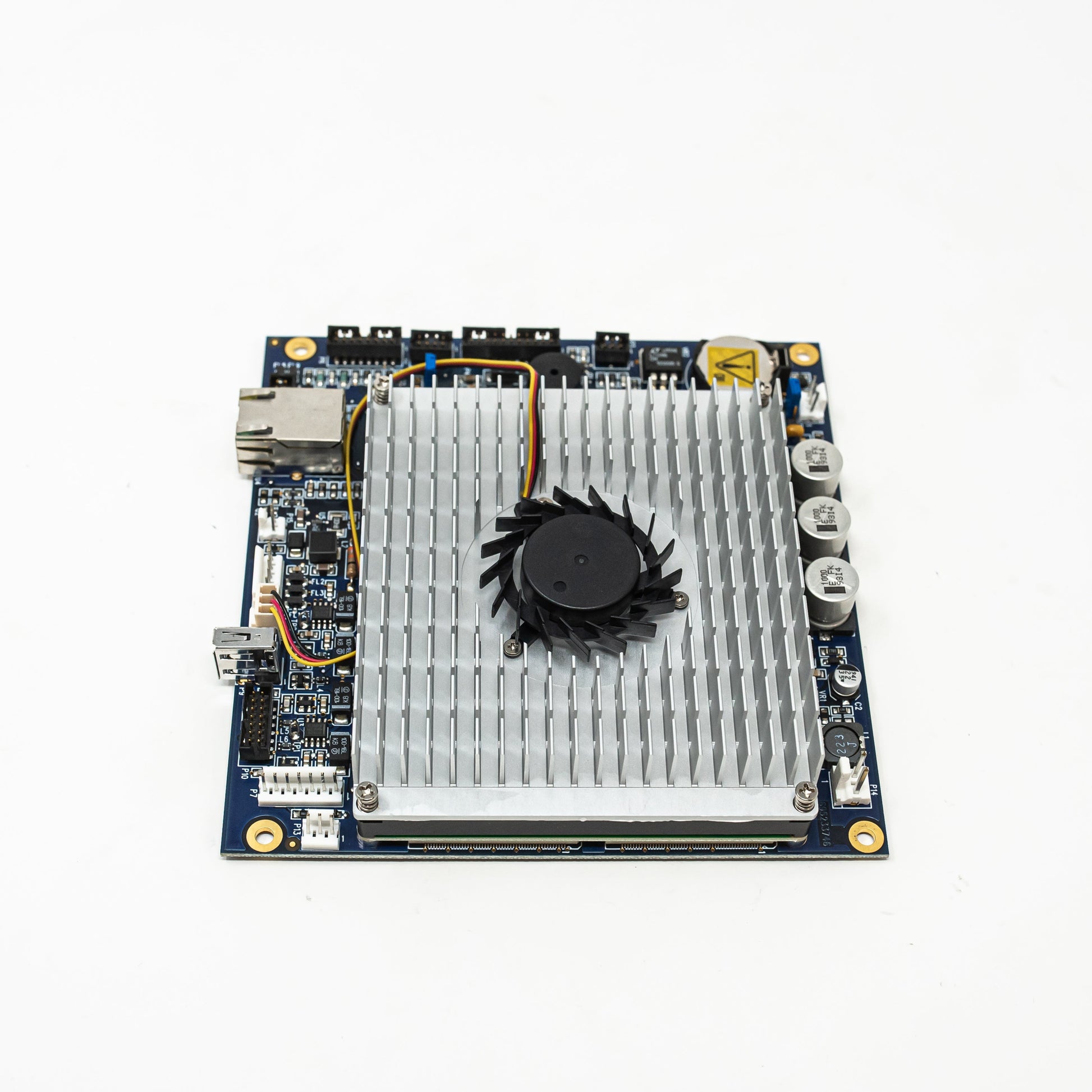 A small circuit board featuring a cooling fan, showcasing its compact design and essential electronic components.