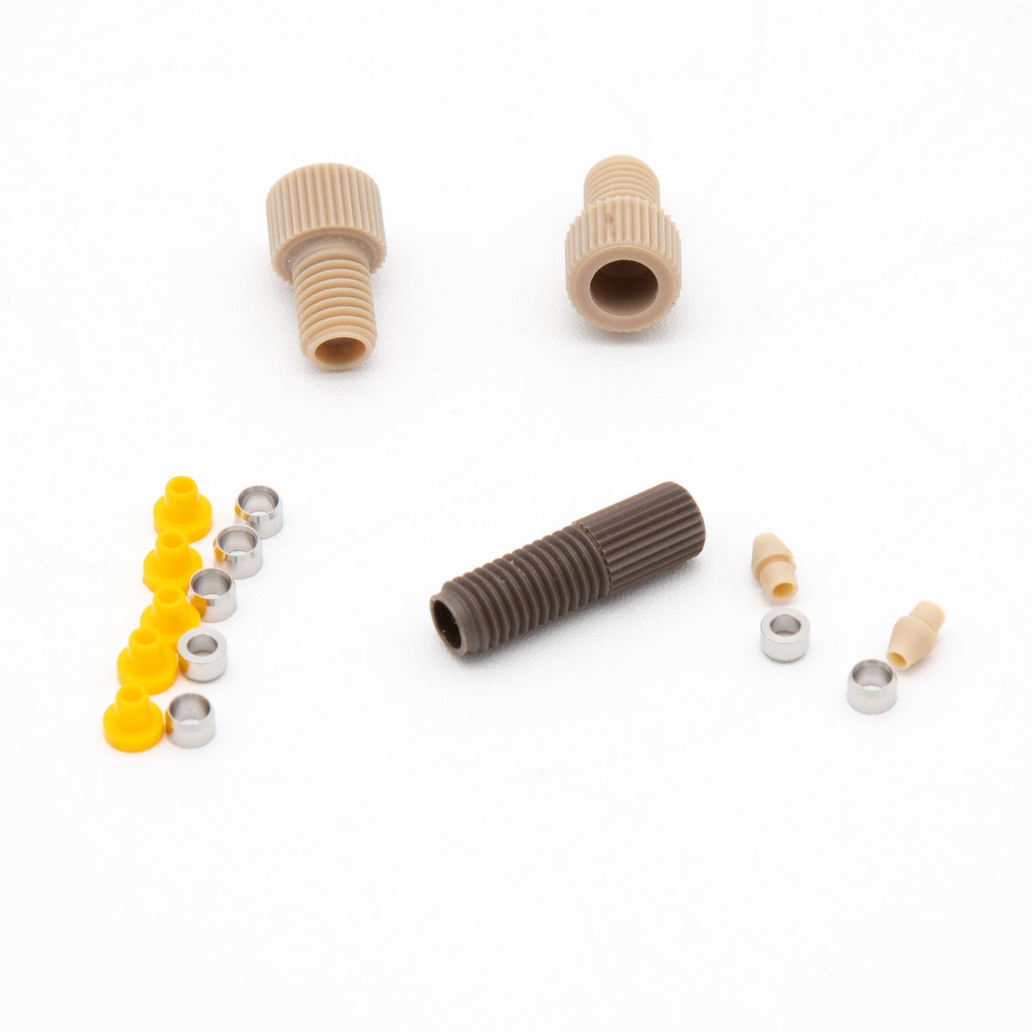 A collection of plastic components featuring screws, nuts, and washers arranged together on a neutral background.