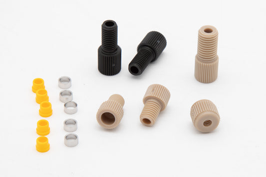 A collection of assorted plastic fittings and screws arranged neatly for easy identification and selection.