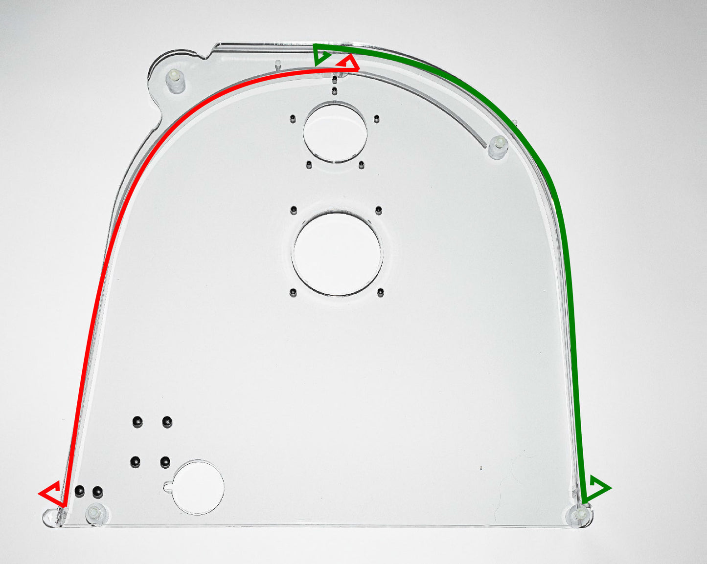 The side of a clear box displays red and green arrows directing attention to the relevant holes for functionality.