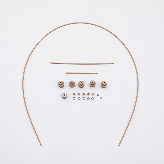 A set of tan-colored nuts and matching metal fittings arranged on a plain white background, with three varied sizes of tubing.