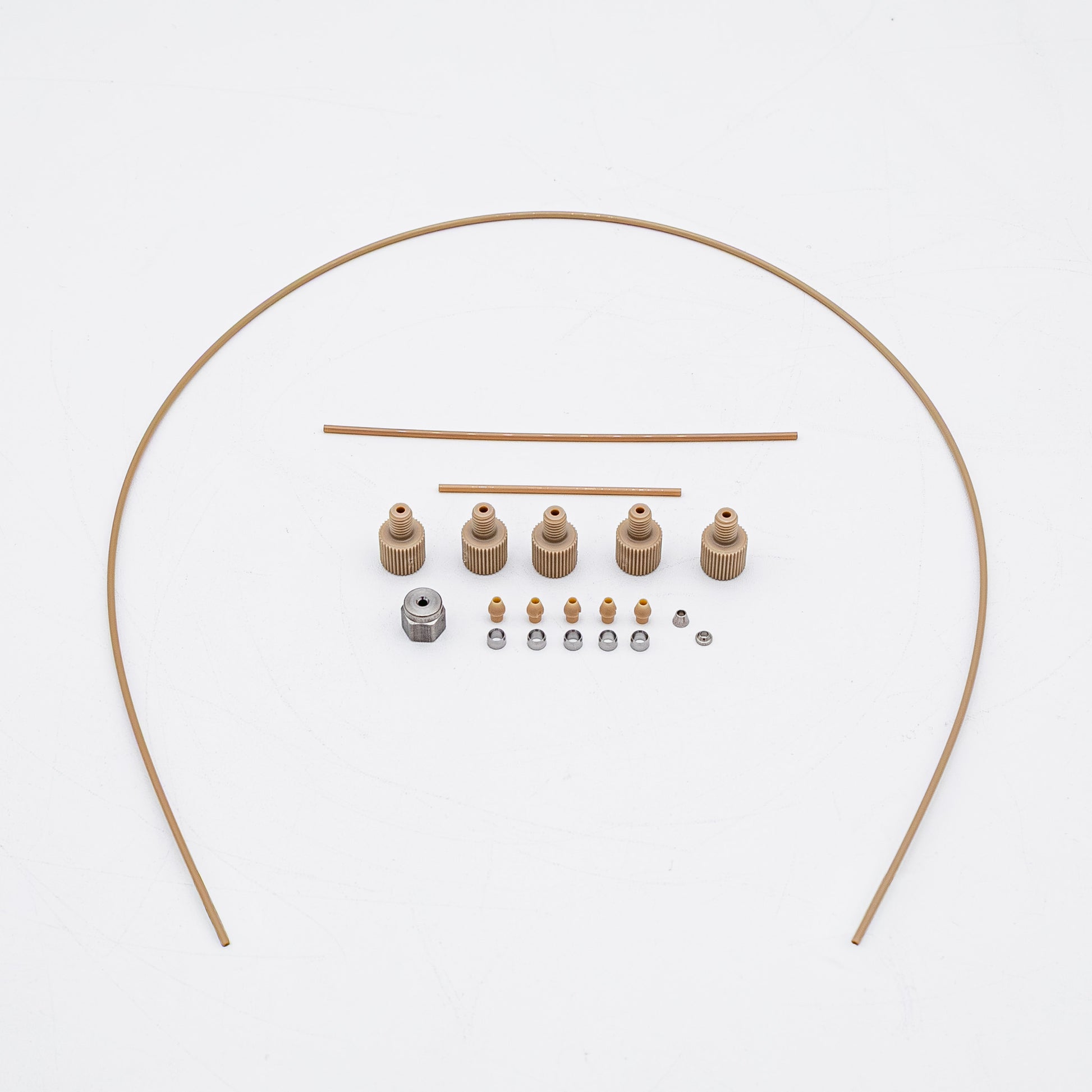 A set of tan-colored nuts and matching metal fittings arranged on a plain white background, with three varied sizes of tubing.