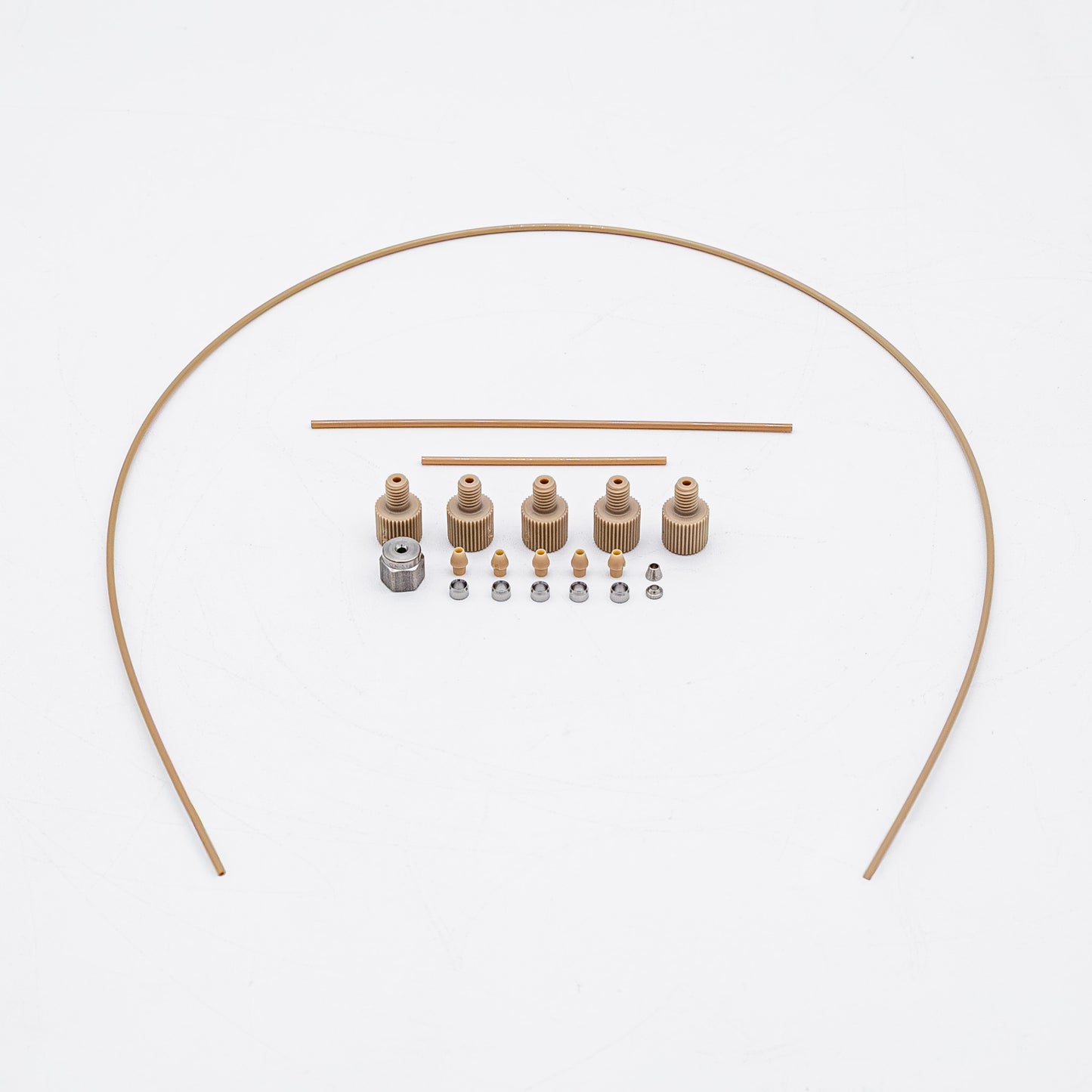 A set of tan-colored nuts and matching metal fittings arranged on a plain white background, with three varied sizes of tubing.