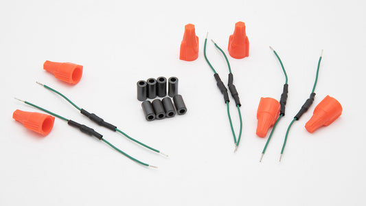 An assortment of orange and black electrical connectors, emphasizing their contrasting colors and functional design.