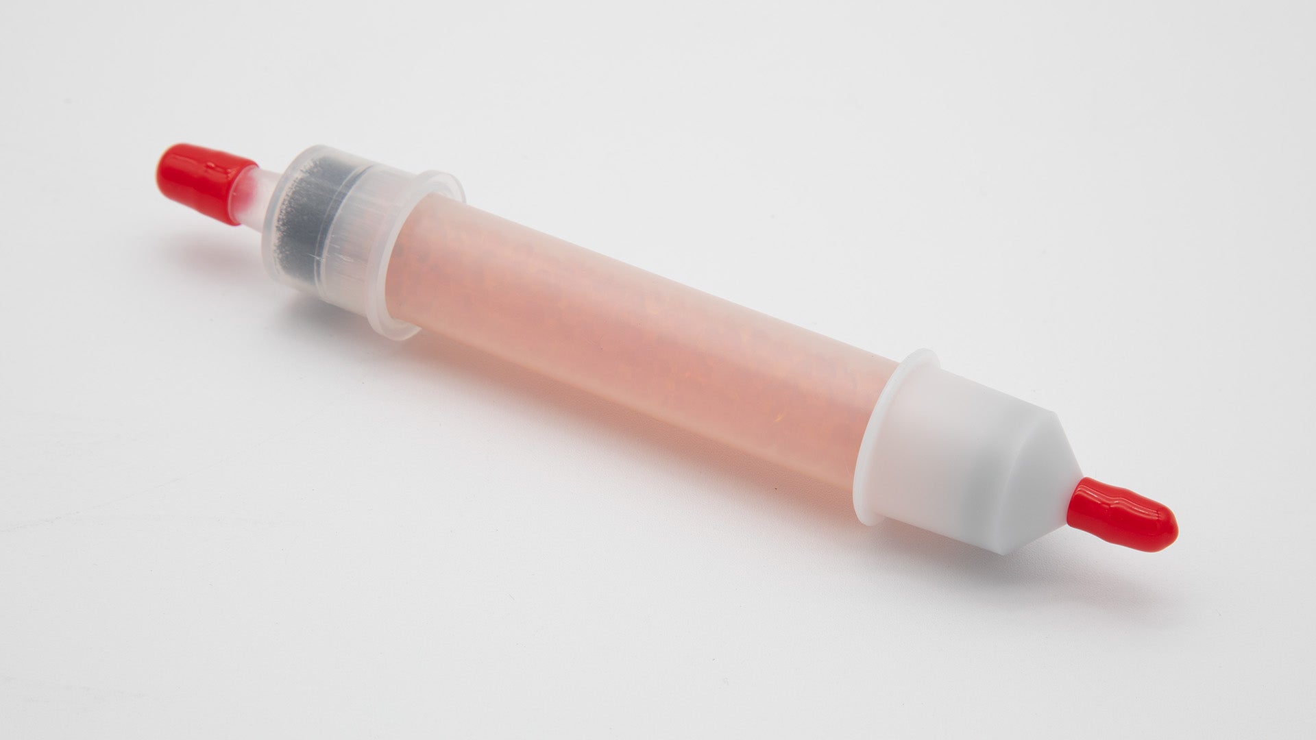 A plastic tube with caps filled with desiccant