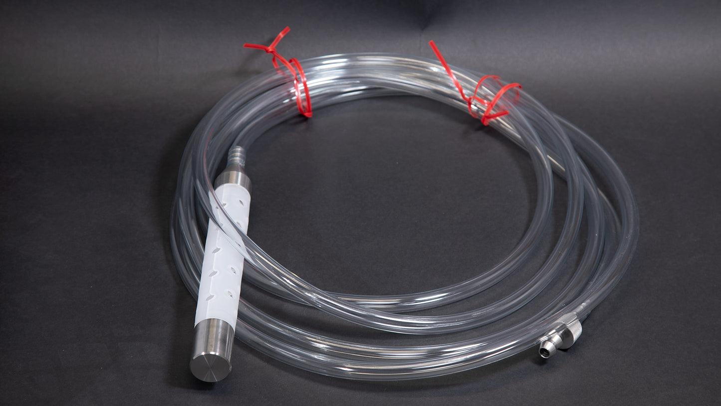 A roll of clear hose with a white plastic device with holes, coiled and ready for use in various applications.