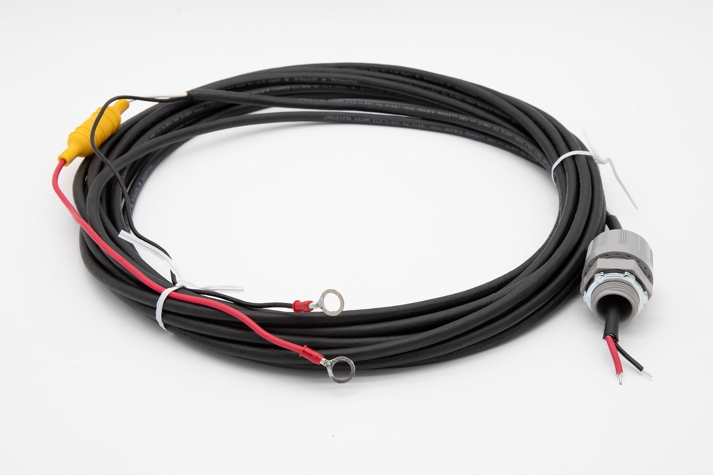 A black cable featuring yellow and red wires, showcasing a simple yet functional design for electrical connections.