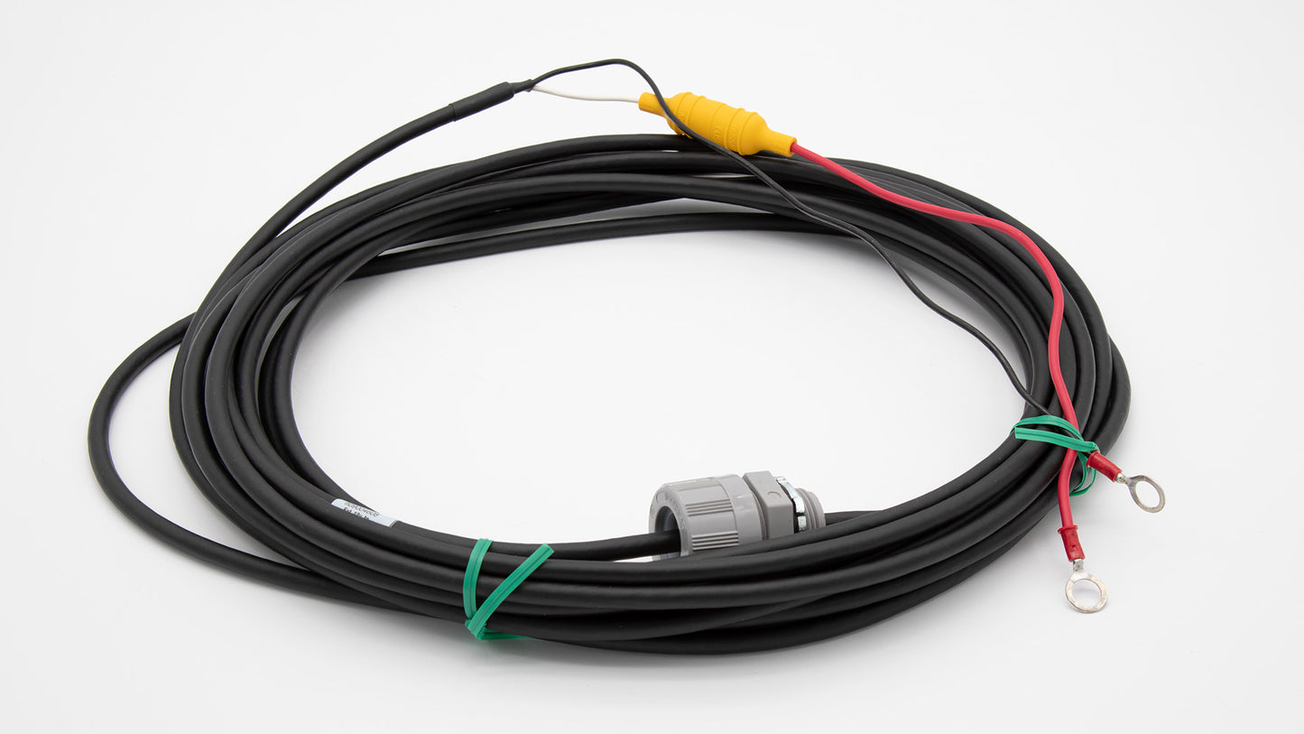 A roll of black cable with red and green wires.