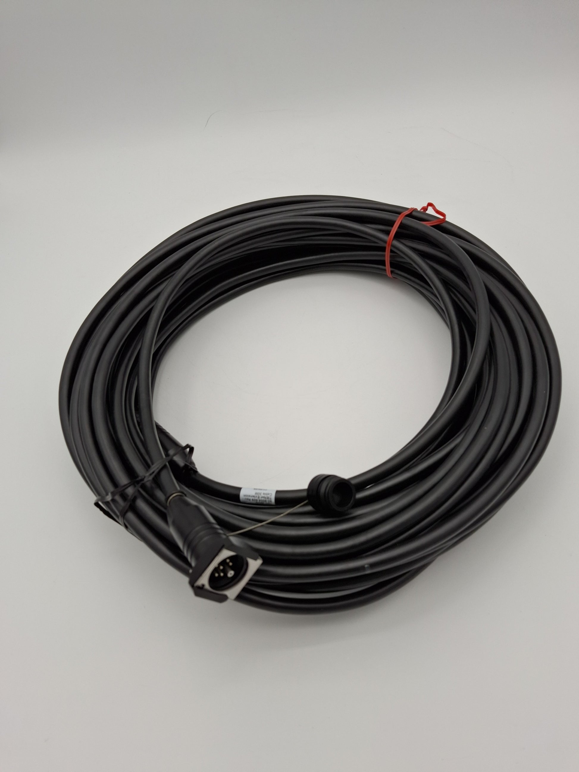 A black cable with connectors, showcasing a striking contrast in color and design.