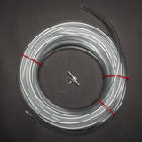Roll of clear tubing with two metal objects