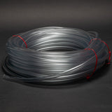 Roll of clear tubing with two metal objects