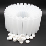 A group of white plastic bottles with caps
