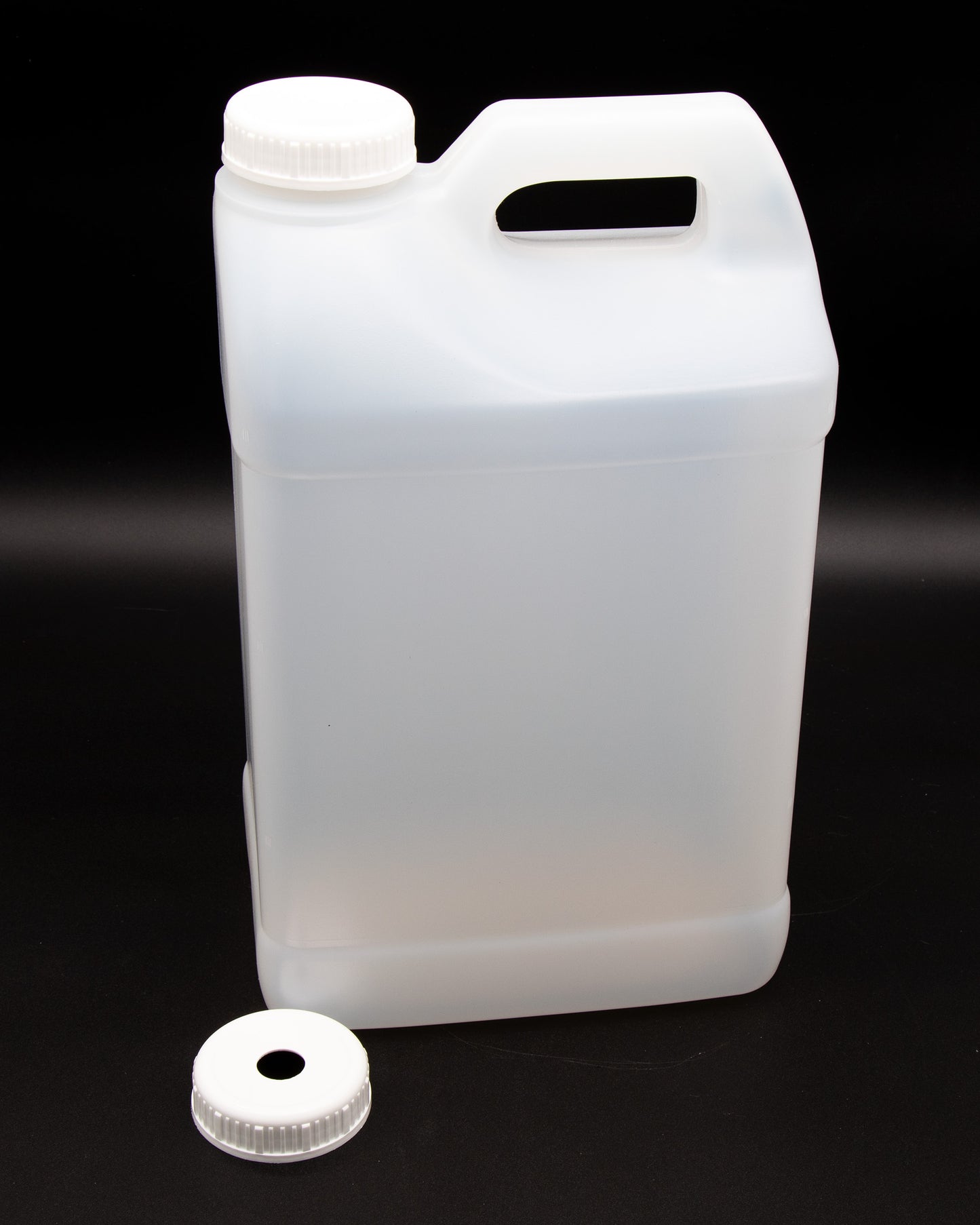 A white plastic jug with two white caps