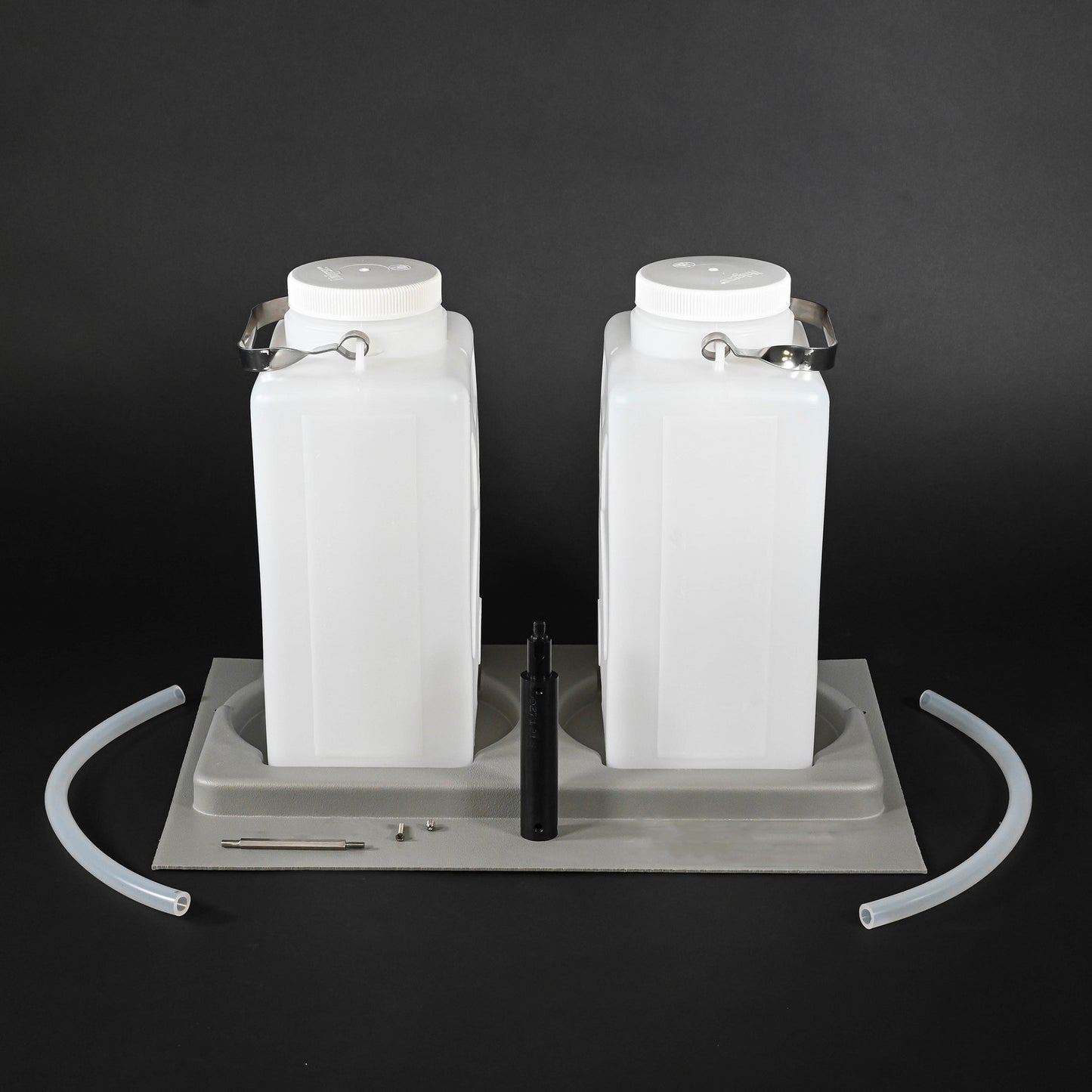 Two white water jugs placed in a grey holder, emphasizing their elegant and functional appearance.