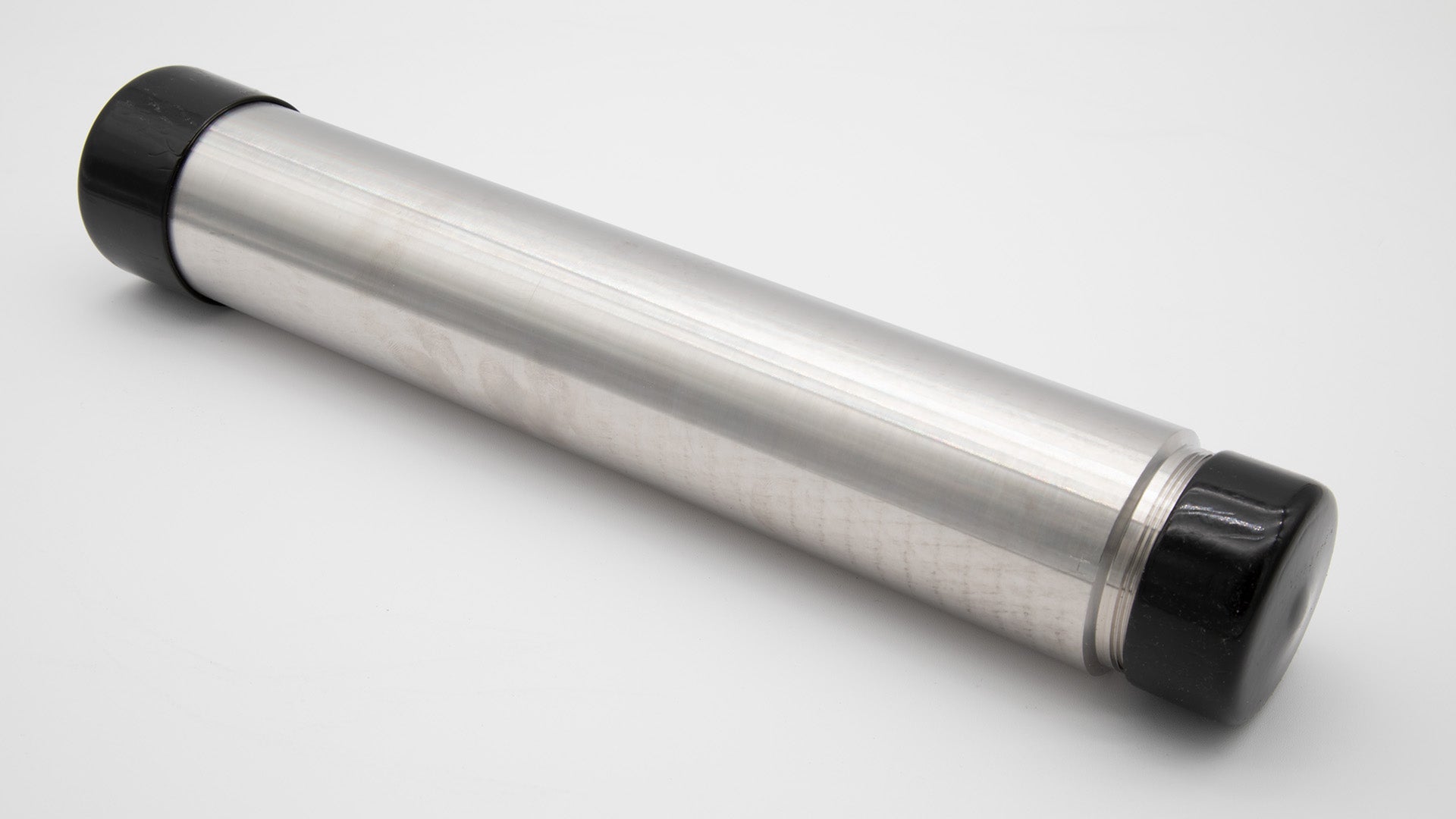 A silver cylinder with caps