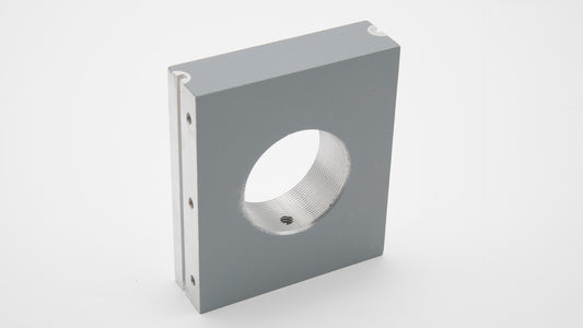 A grey rectangular object with a hole