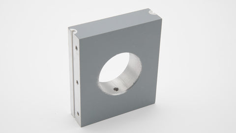 A grey rectangular object with a hole