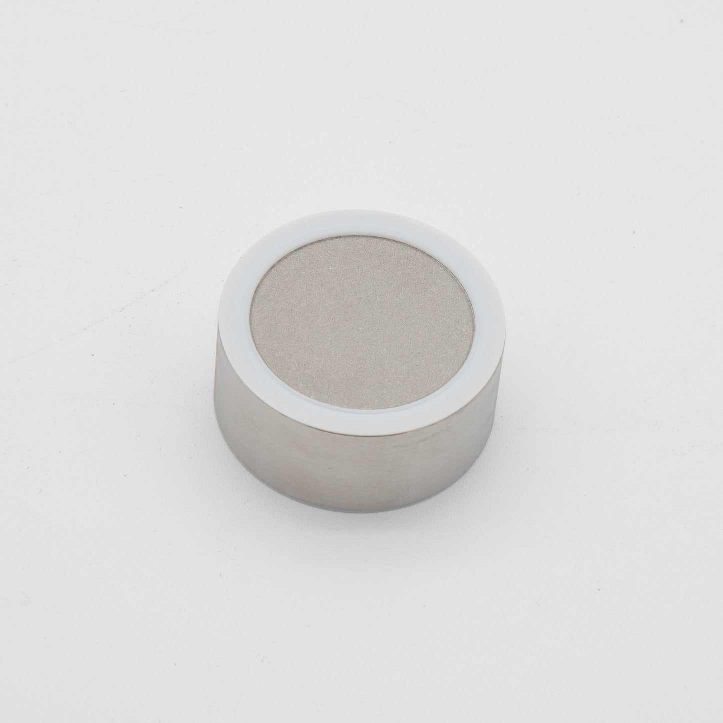 Small metal cylinder, showcasing a sleek and modern design.