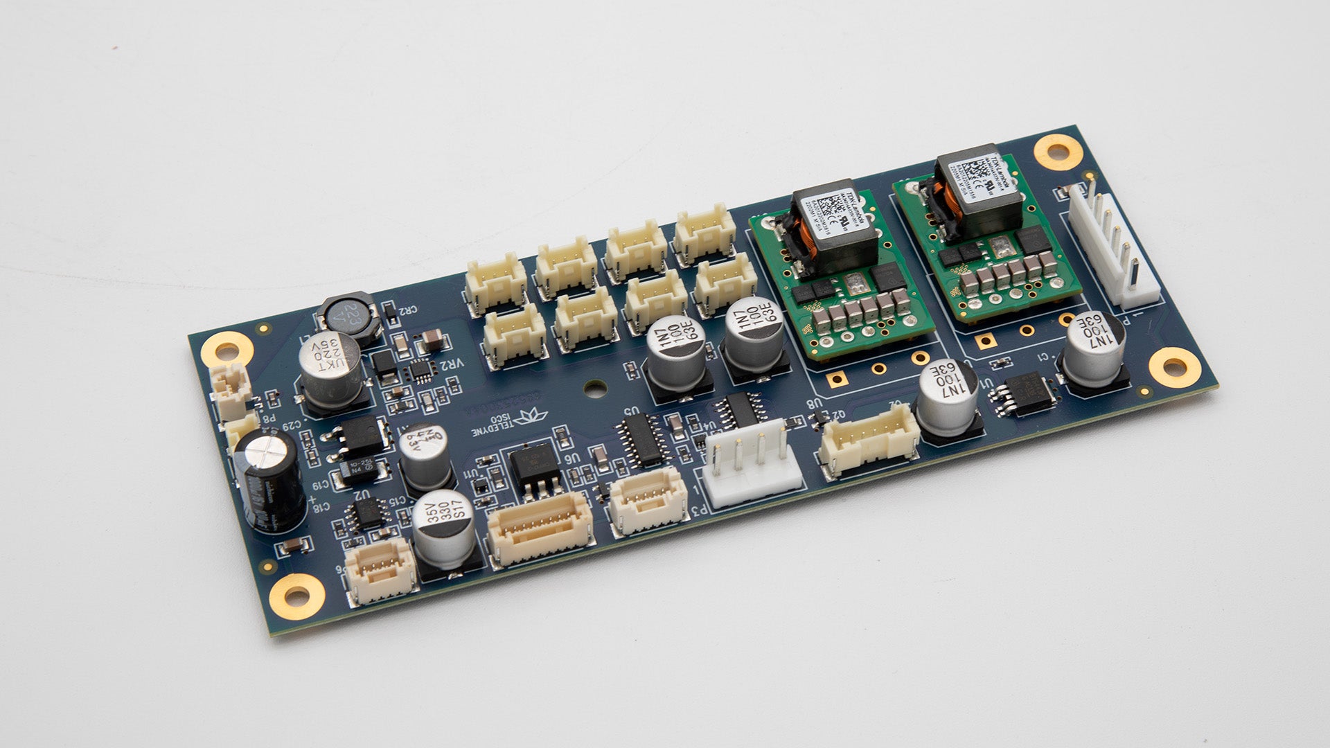 A small electronic circuit board featuring various electronic components arranged neatly on its surface.