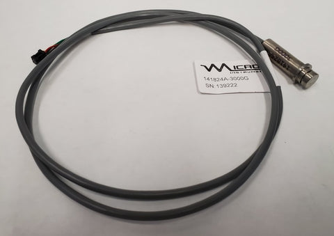 A black cable with a white label and sensor