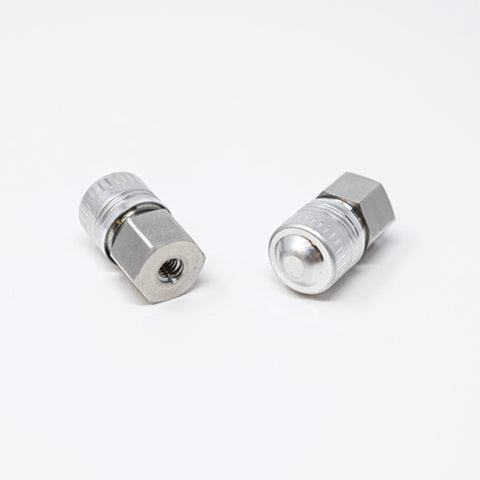 A close-up of a couple of metal nuts