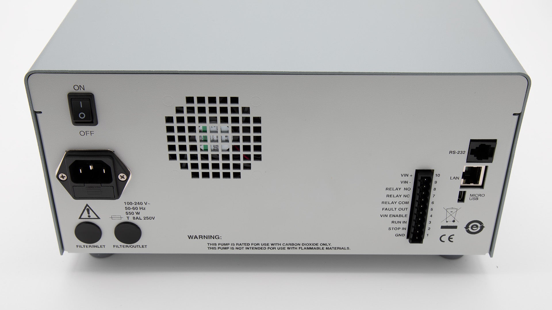 The rear of a square pumping device, picturing various electrical connection point and a fan plate.