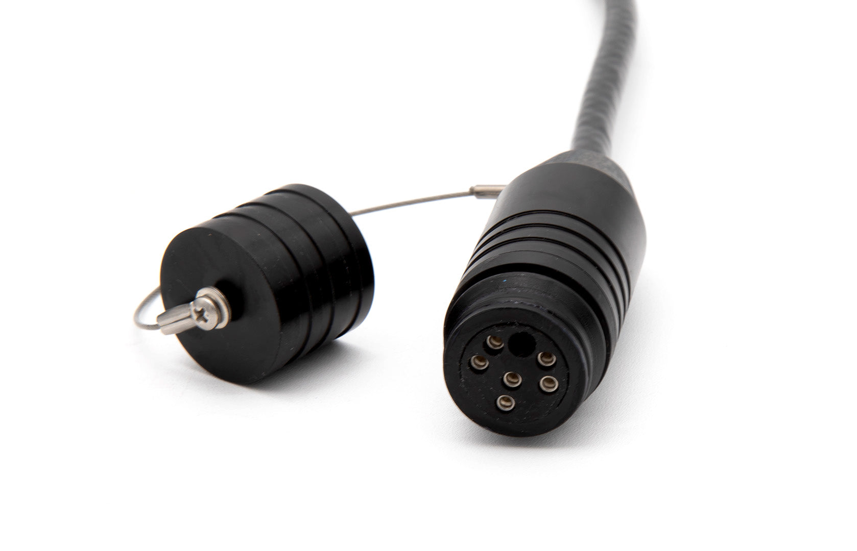 Black industrial cable with connectors on a white background
