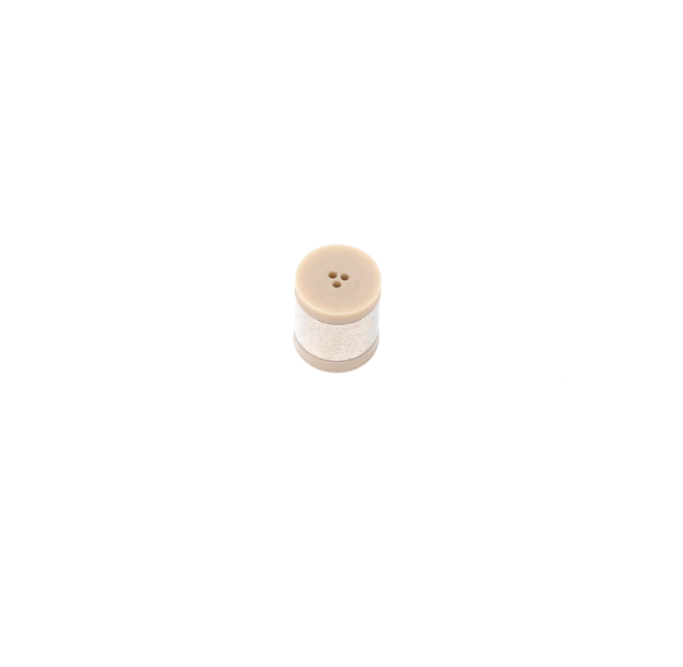 Round plastic cylinder with three small holes on one side and single hole on other.