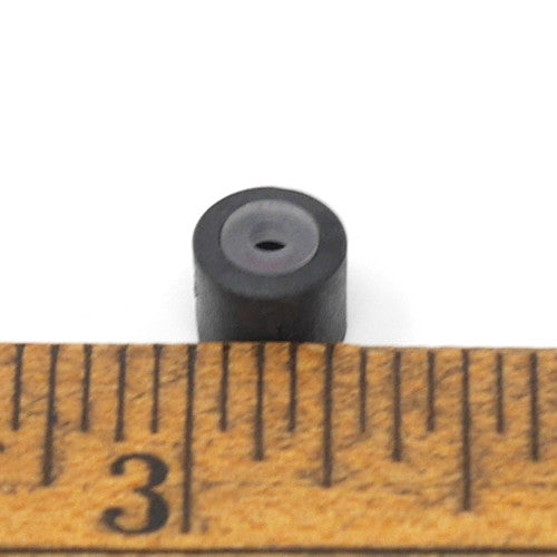 Cylindrical capsule with pass-through hole with measurement.