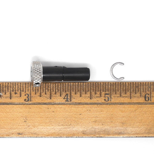 Cylindrical tool with thumbscrew top with measurement.