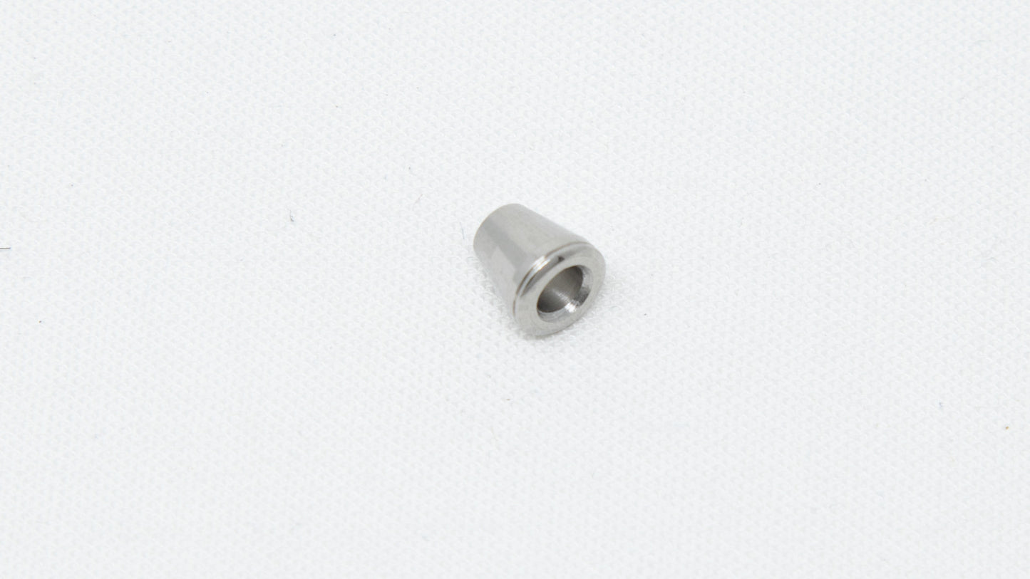 Cone shaped ferrule with hole in middle.