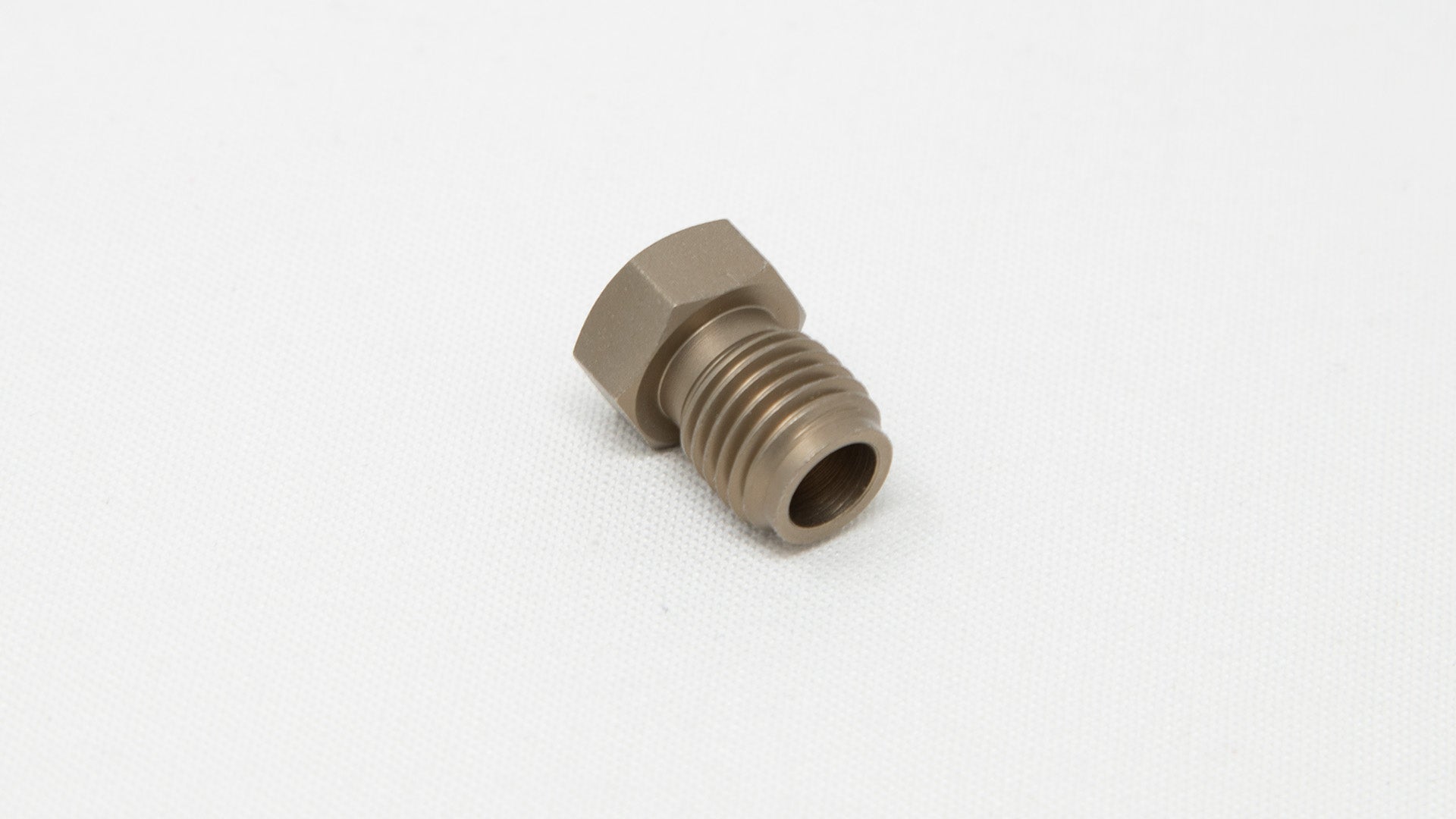 Nut with pass-through hole and threads on one end.