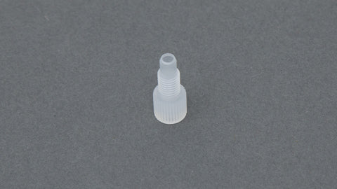 Clear plastic nut with threads.