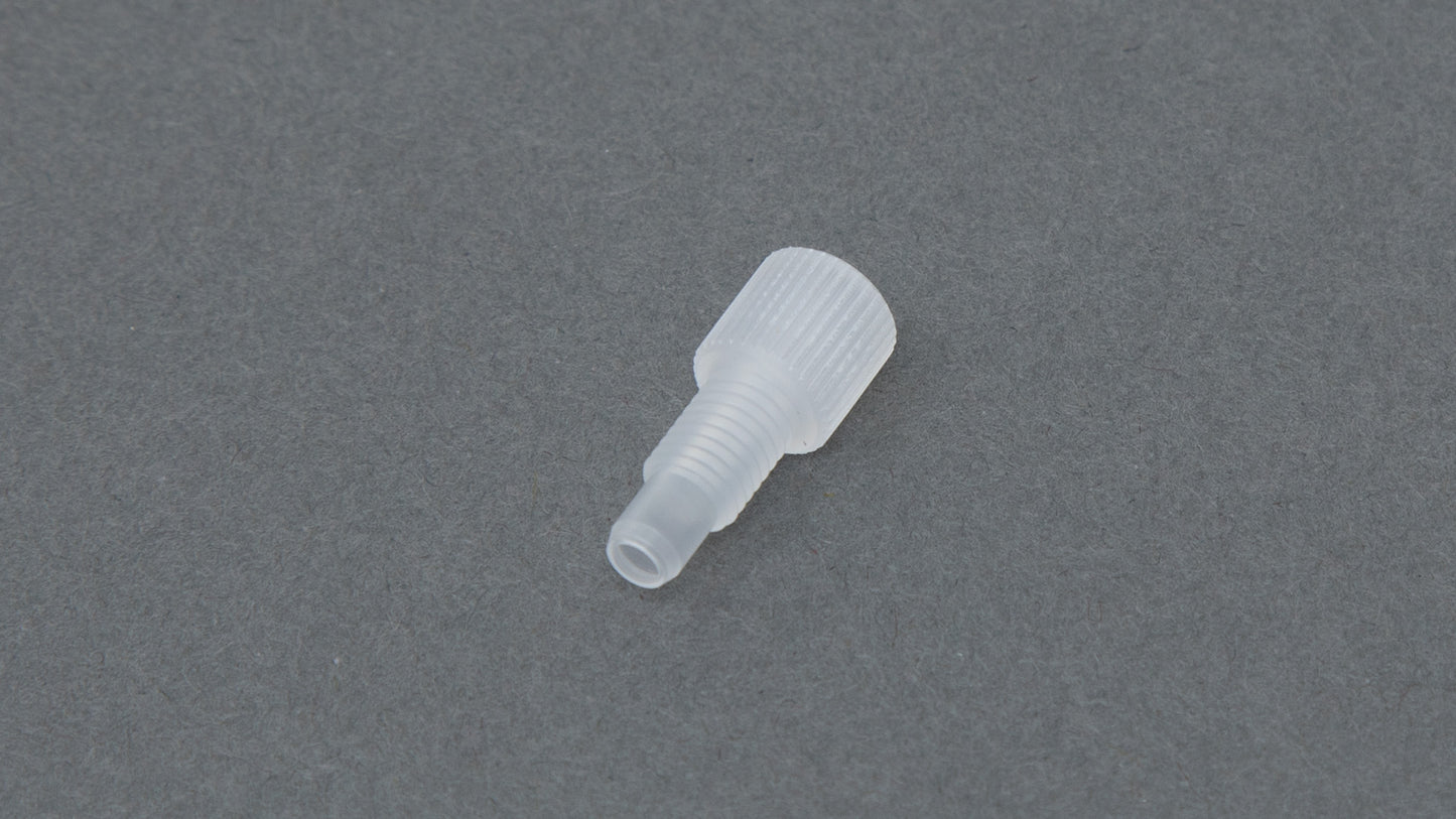 Clear plastic nut with threads.