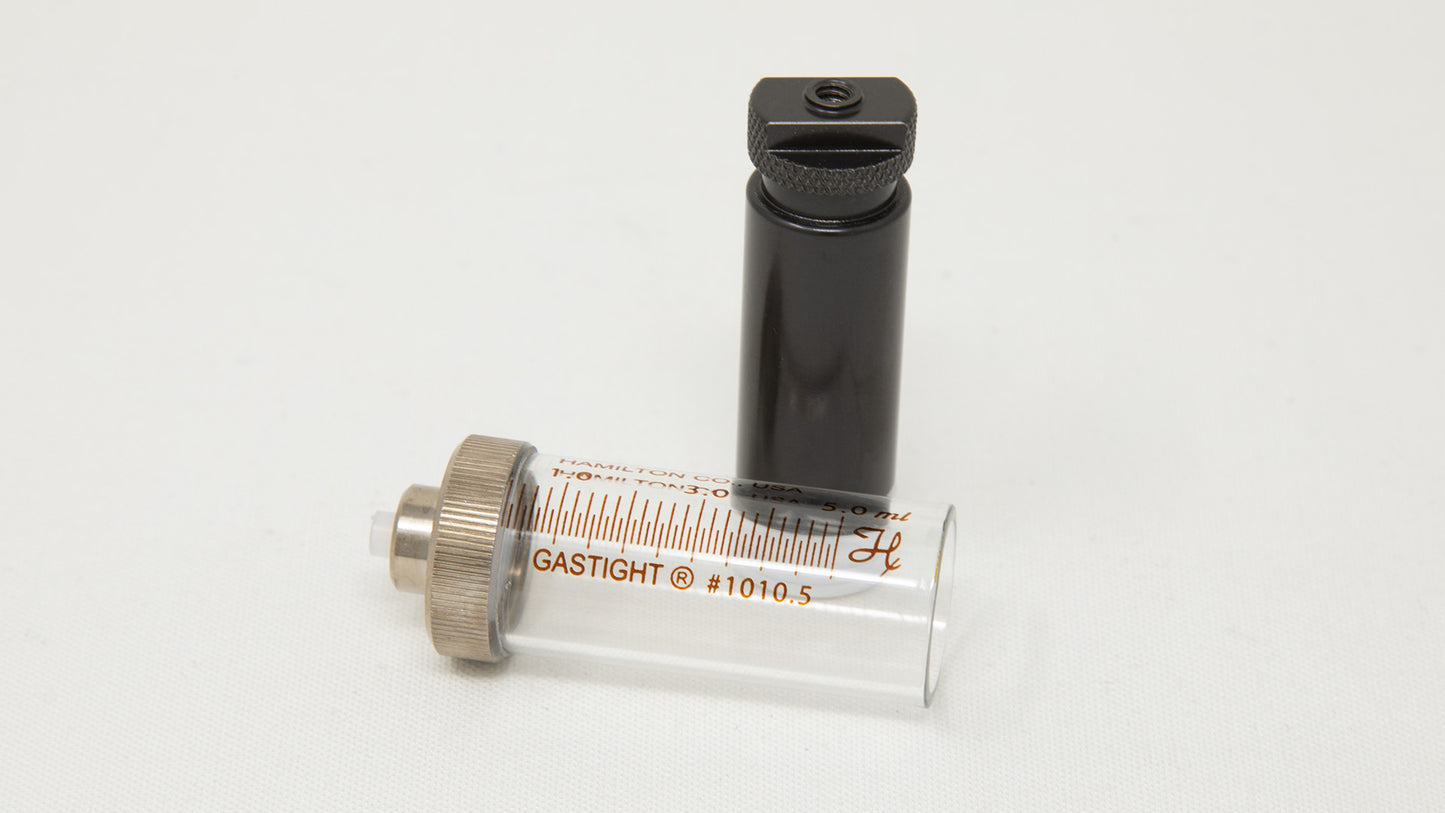 Two piece syringe with measurement markings.