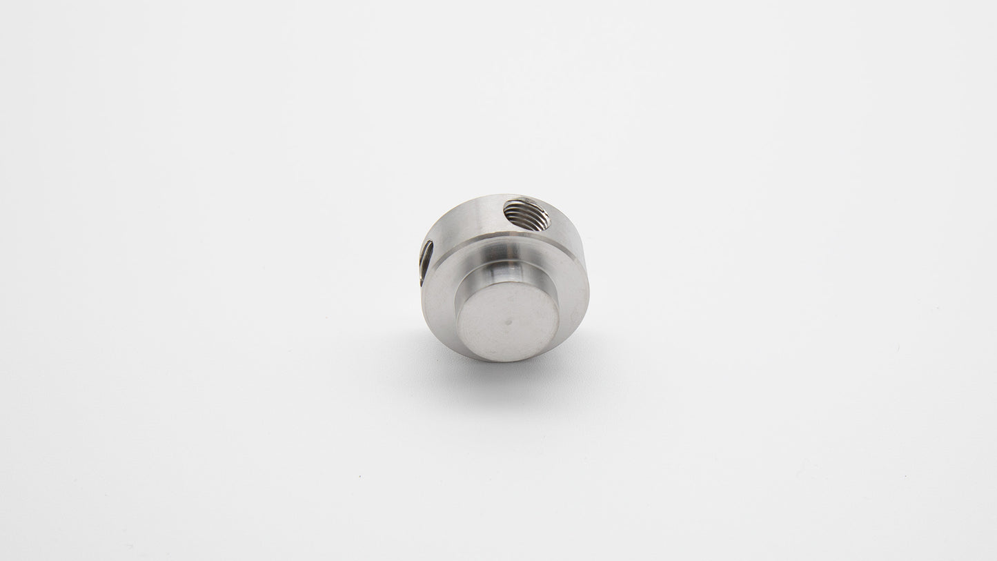 Round cylinder with threaded holes.