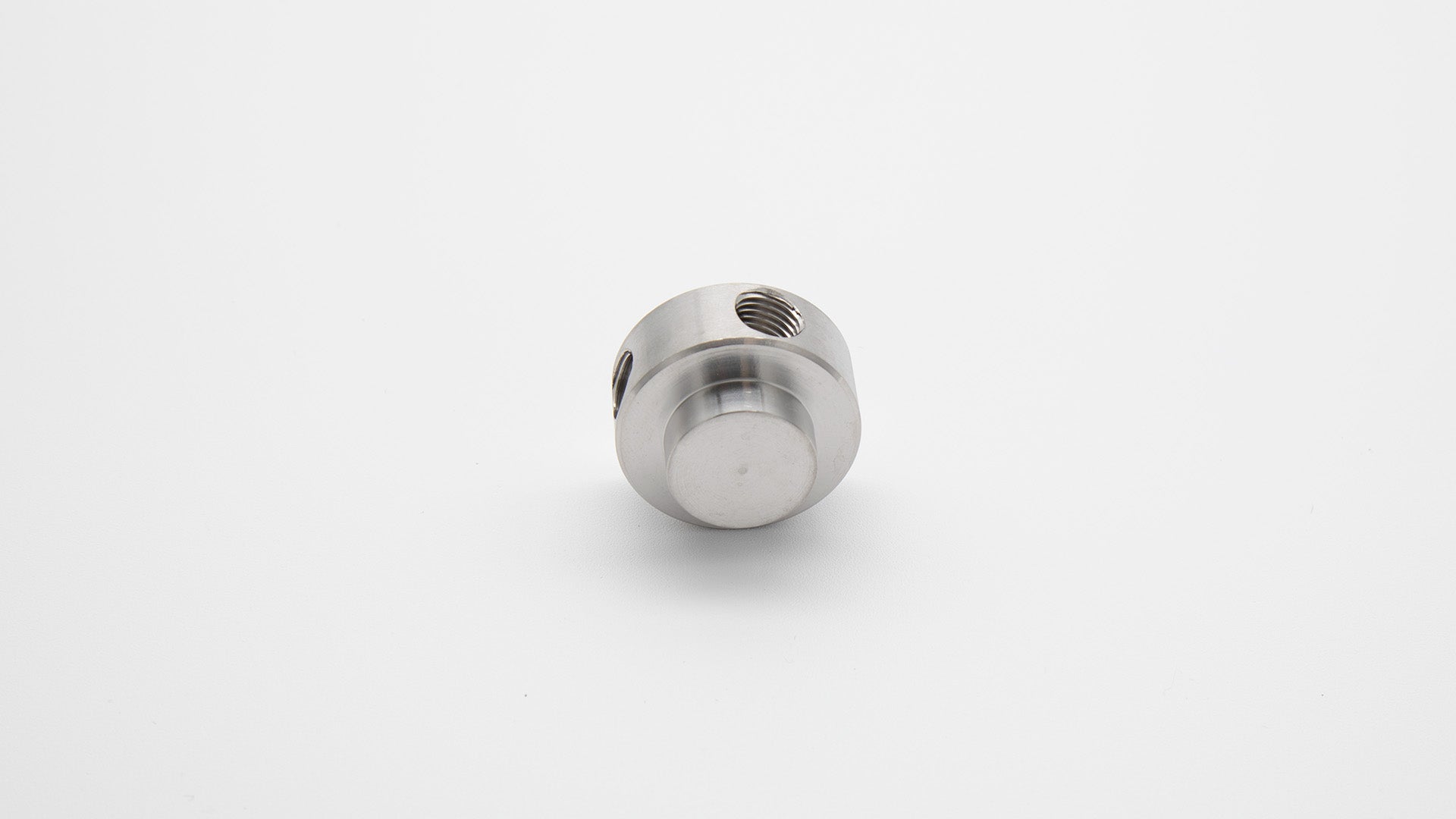 Round cylinder with threaded holes.