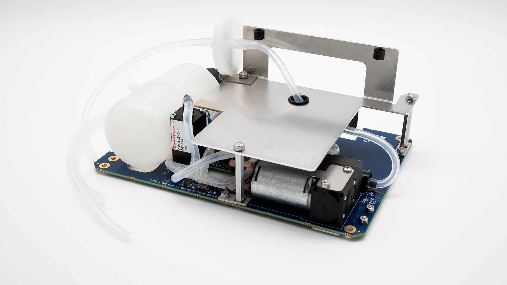 Circuit board with tubing, tank, and bubbler motor.