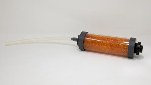 Clear tube filled with desiccant beads with a piece of tubing