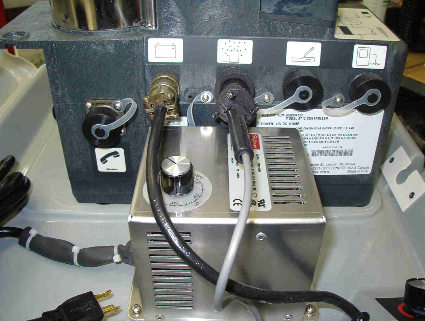 A power cord connected to a small mounted heater, indicating a setup for electrical connectivity.