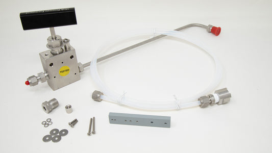 A kit containing a hose, valve, and various components for assembly or repair tasks.