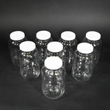 Eight glass bottles with caps